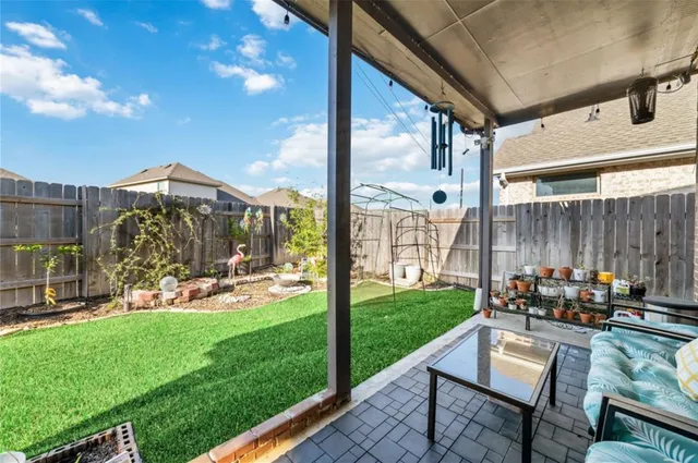 a bathroom with a large tub and shower