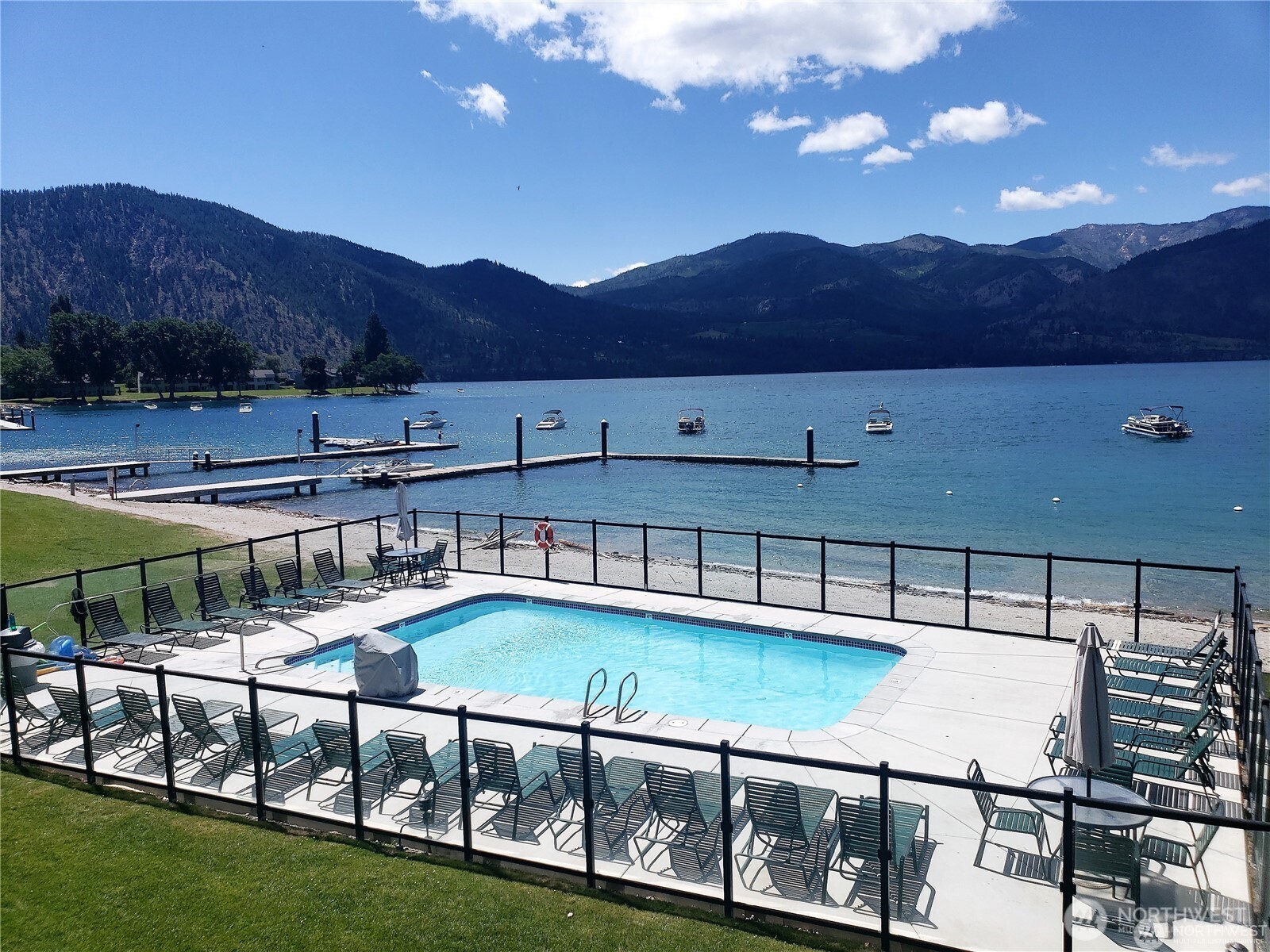 1 Lakeside 708-k Manson, WA 98831 - Photo 16 of 37 a view of a swimming pool with a mountain