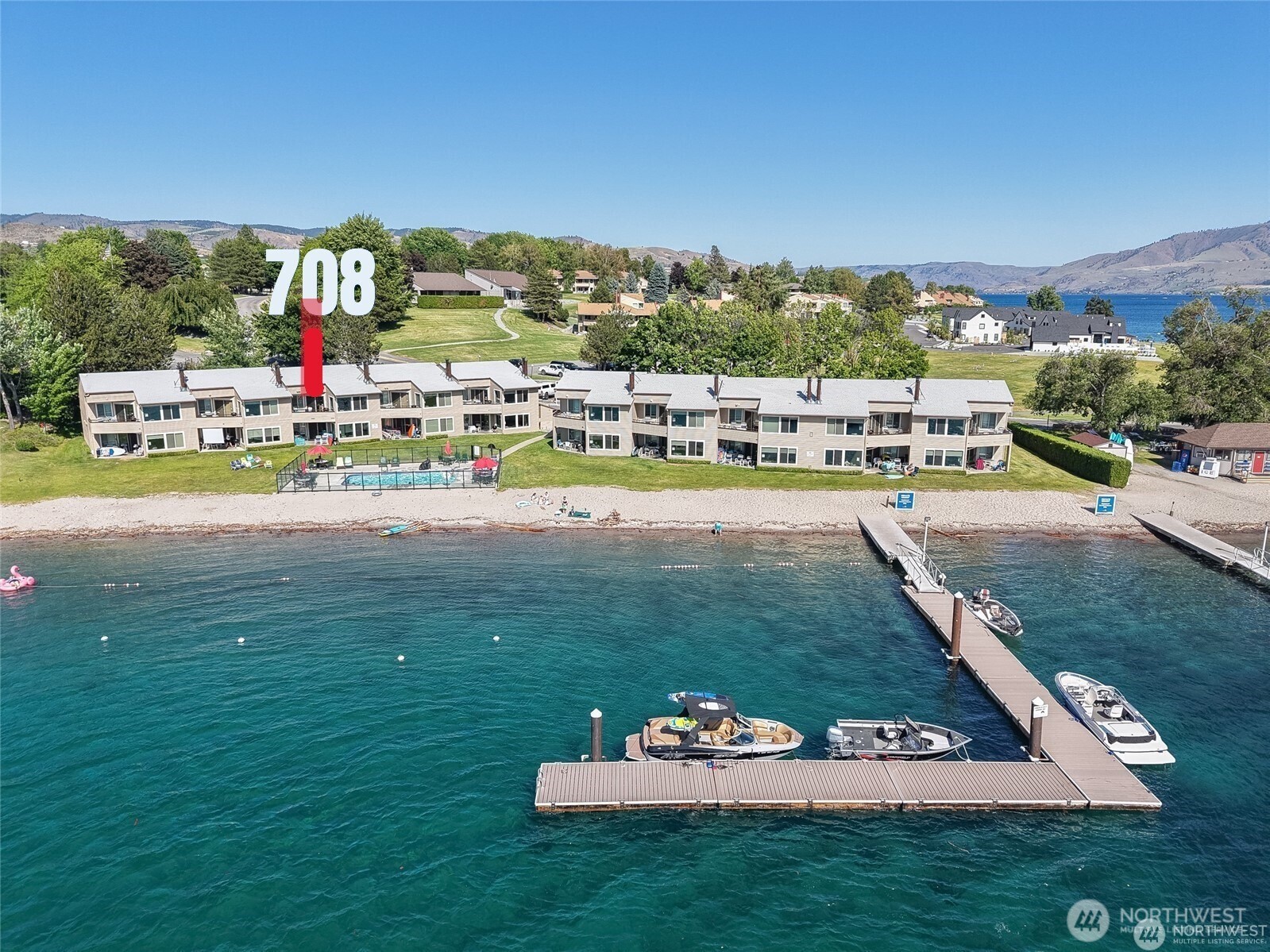 1 Lakeside 708-k Manson, WA 98831 - Photo 3 of 37 an aerial view of a play ground and trees in the background