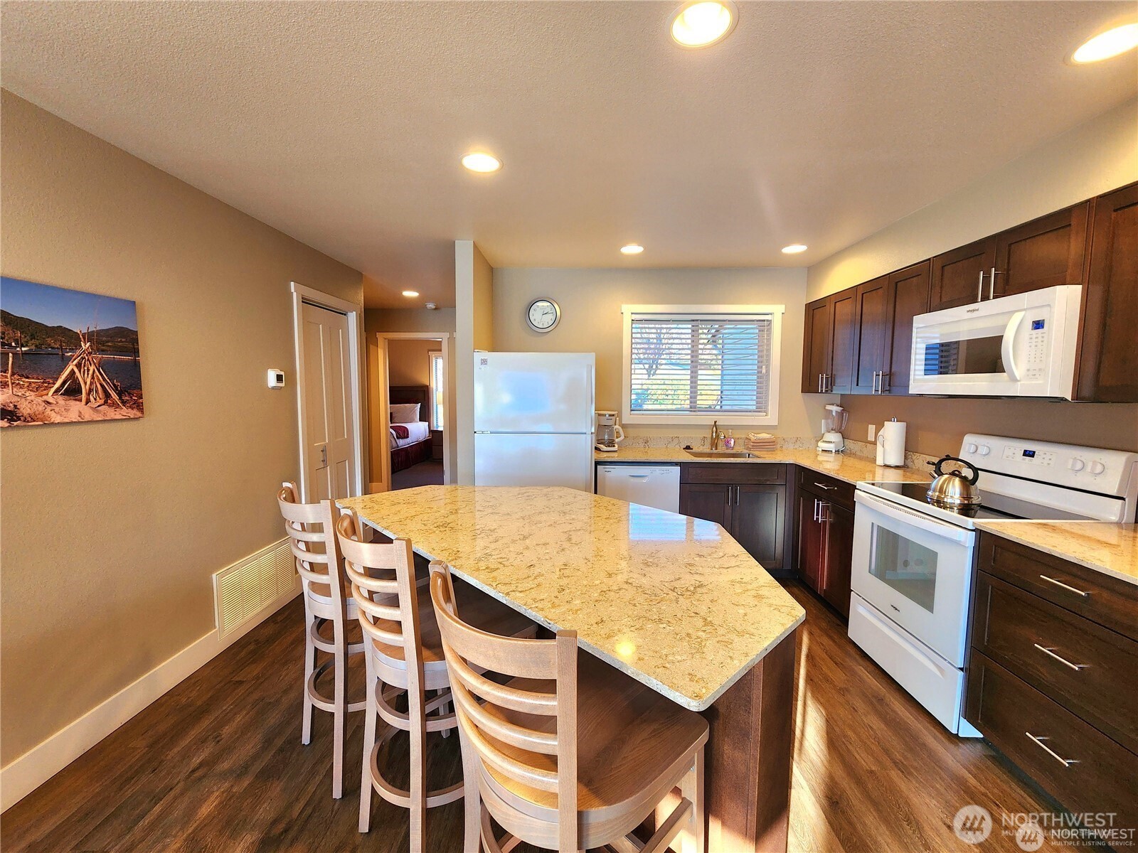 1 Lakeside 708-k Manson, WA 98831 - Photo 9 of 37 a kitchen with stainless steel appliances refrigerator dining table and chairs