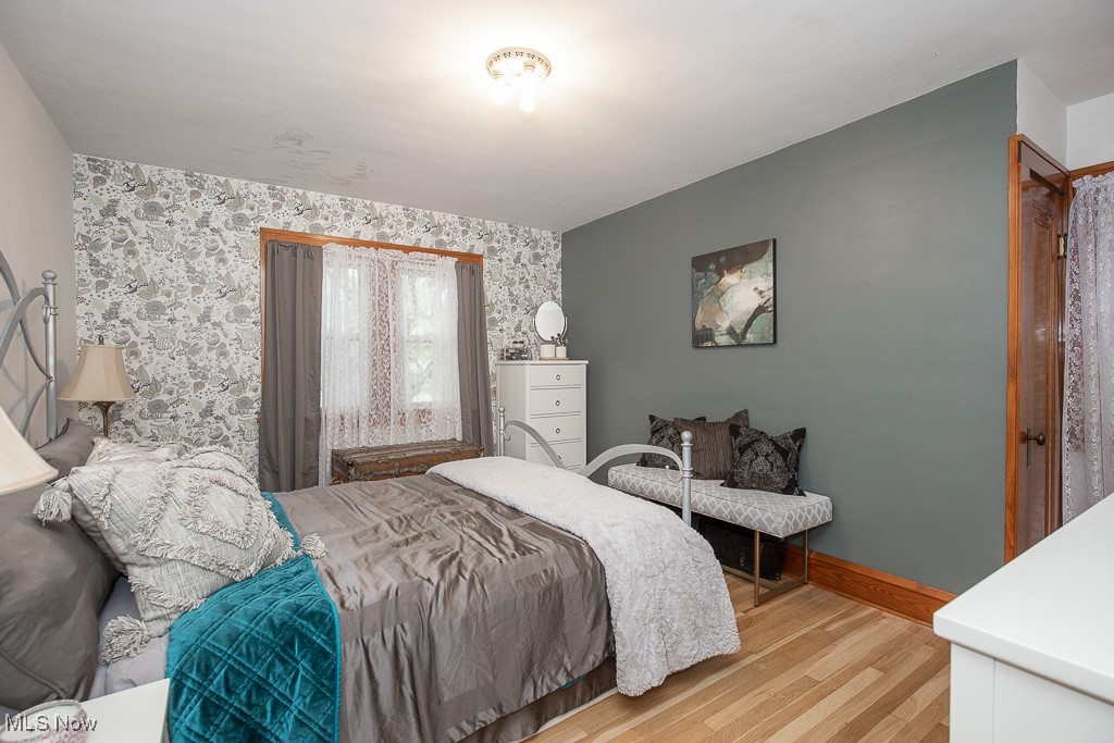 7070 Ridge Road Parma, OH 44129 - Photo 16 of 28 Bedroom featuring light hardwood / wood-style flooring