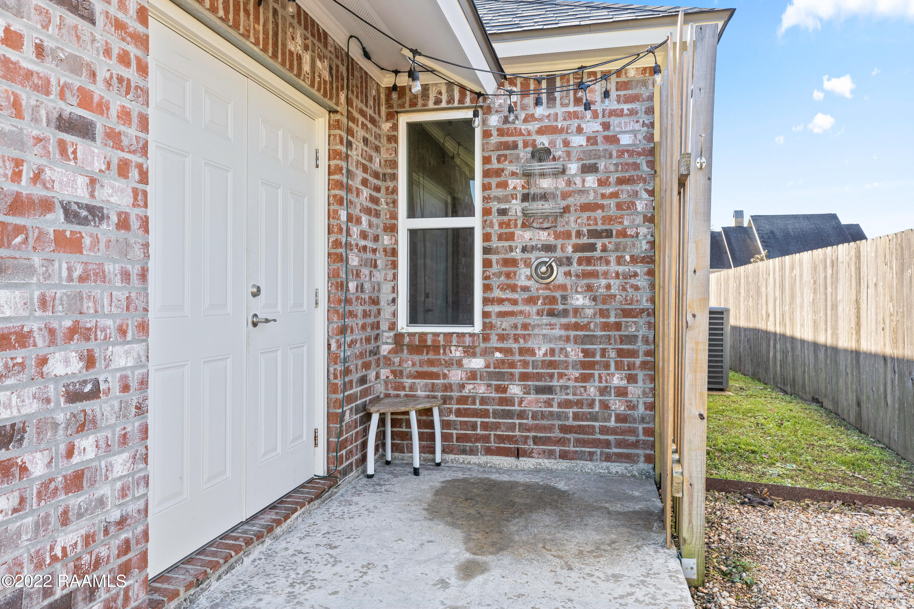 205 Talon Road Youngsville, LA 70592 - Photo 26 of 28 Outdoor Shower and storage
