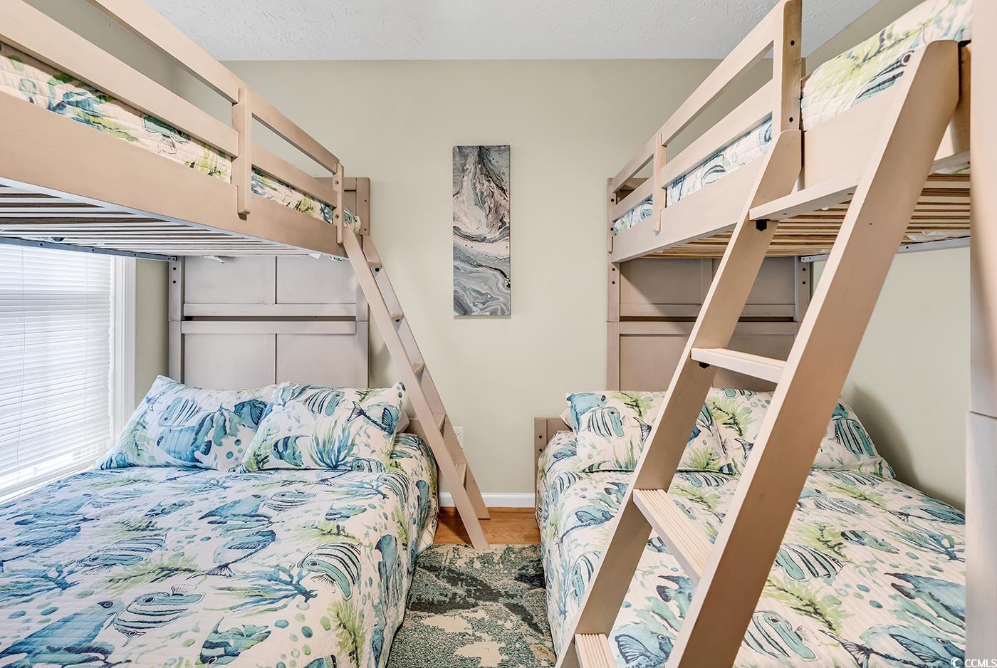 17 South Oak Drive Surfside Beach, SC 29575 - Photo 28 of 38 Bedroom with wood finished floors and baseboards