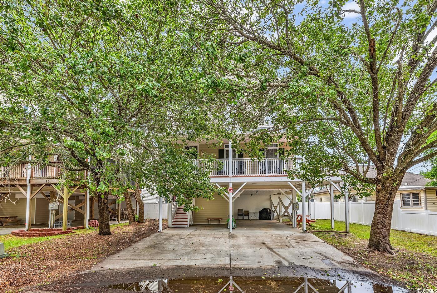 17 South Oak Drive Surfside Beach, SC 29575 - Photo 38 of 38 View of front of house with a carport, fence, and driveway