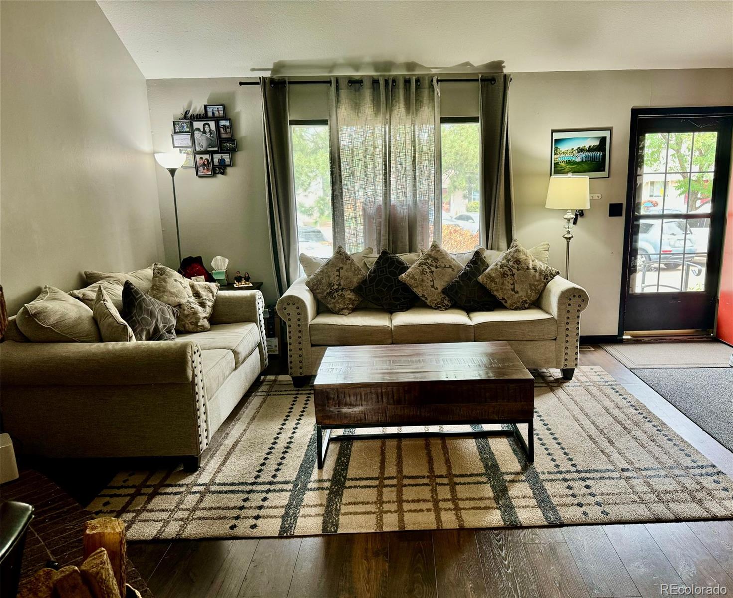 1254 South Reed Street, Unit 1 Lakewood, CO 80232 - Photo 2 of 19 a living room with furniture and a couch