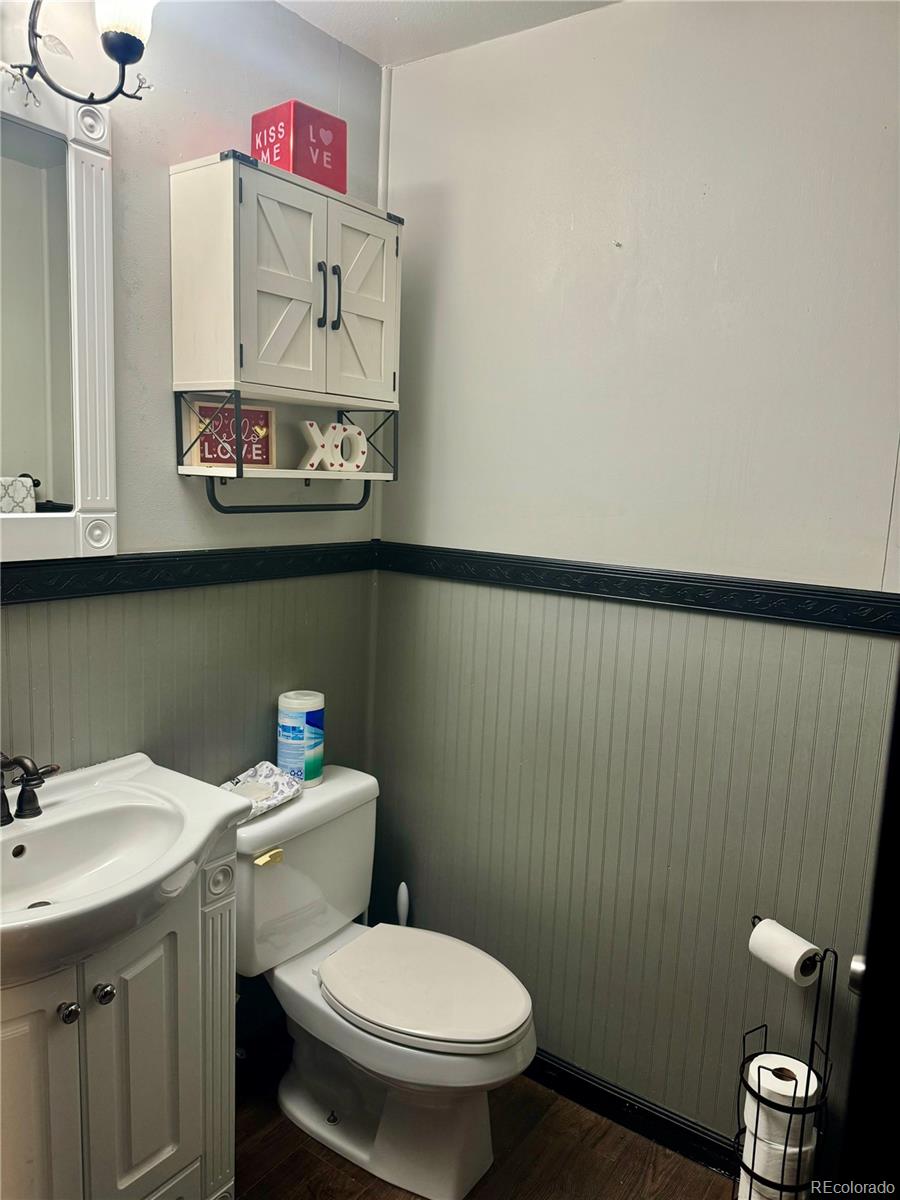 1254 South Reed Street, Unit 1 Lakewood, CO 80232 - Photo 9 of 19 a bathroom with a sink and a toilet