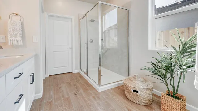 a bathroom with a bathtub and shower