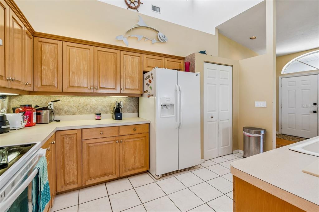 119 Burns Road Terra Ceia, FL 34250 - Photo 20 of 100 a kitchen with stainless steel appliances granite countertop a refrigerator sink and cabinets