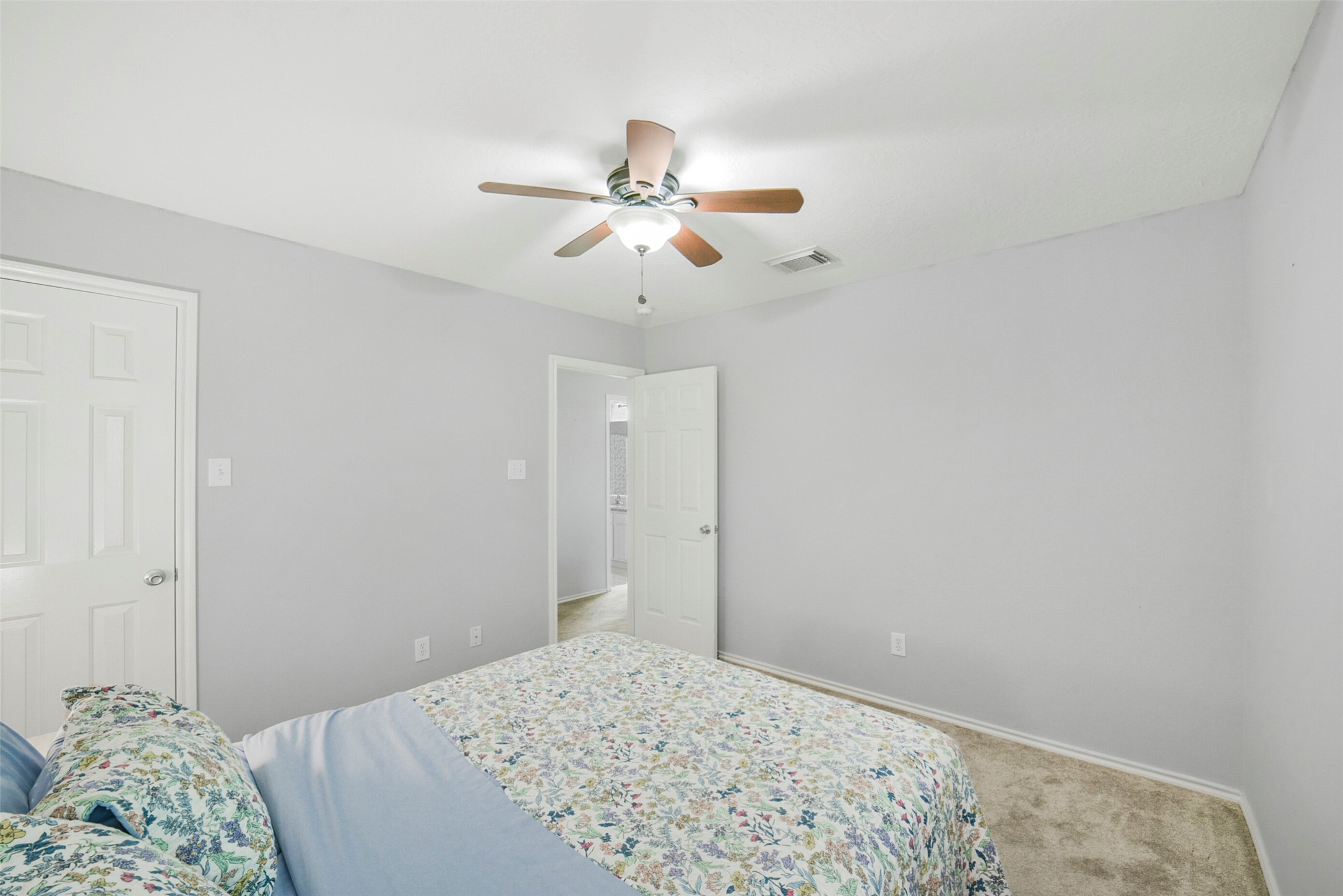 38 Tallow Hill Place Spring, TX 77382 - Photo 32 of 50 a bedroom with a bed and a chandelier fan