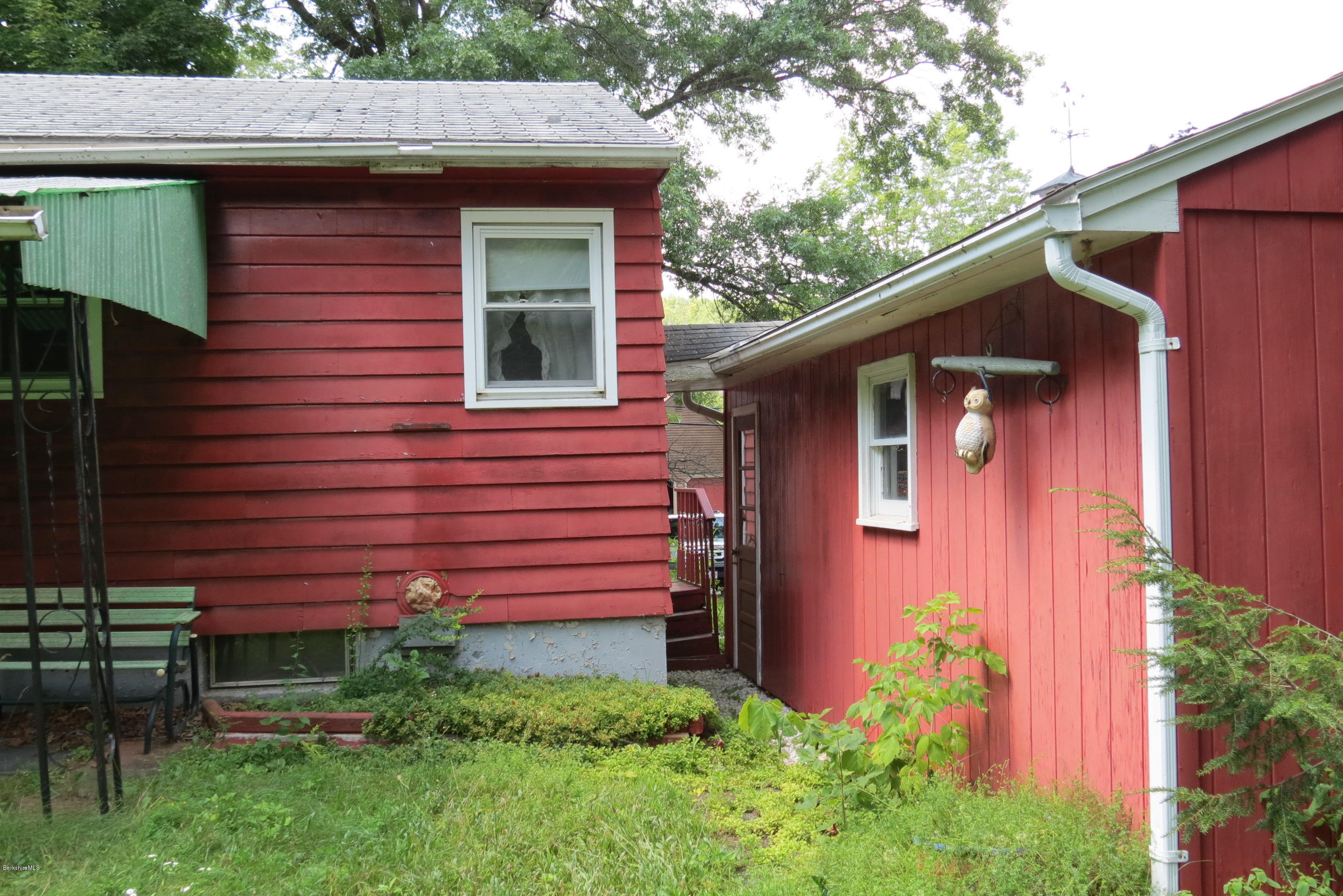 35 East Road Adams, MA 01220 - Photo 14 of 44 a front view of a house with garden