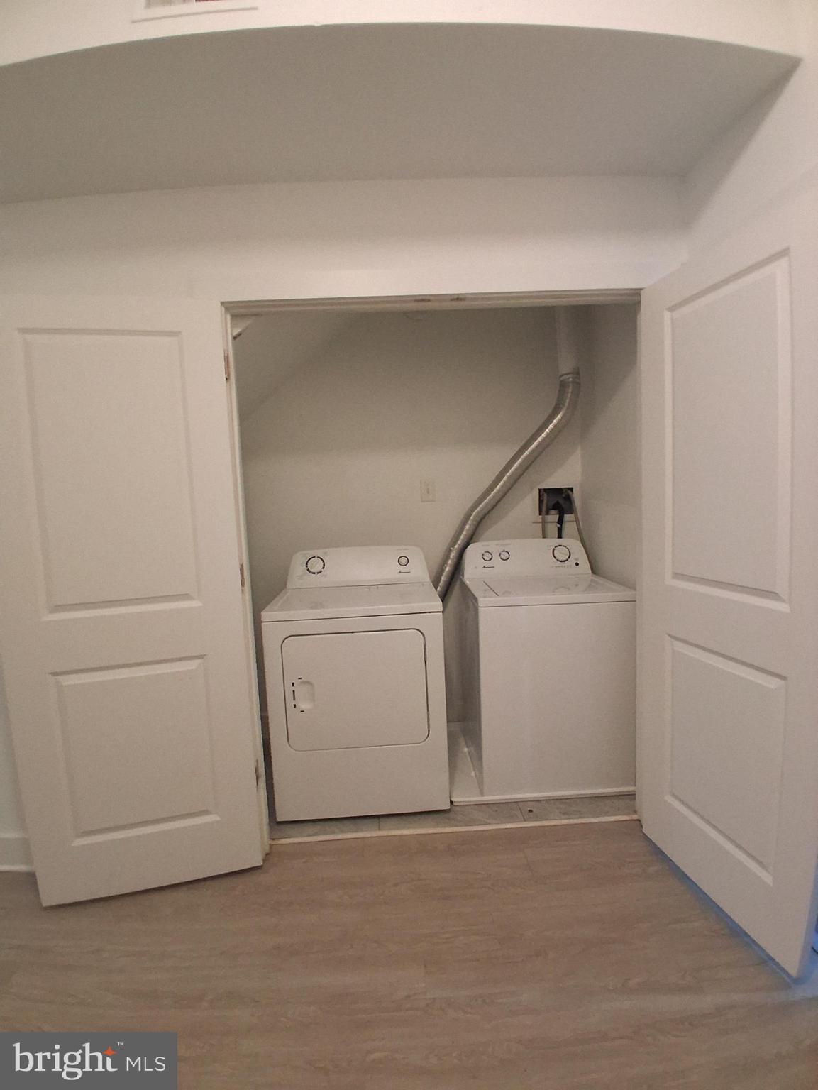6104 Market Street, Unit 2 Philadelphia, PA 19139 - Photo 7 of 11 a utility room with dryer and washer