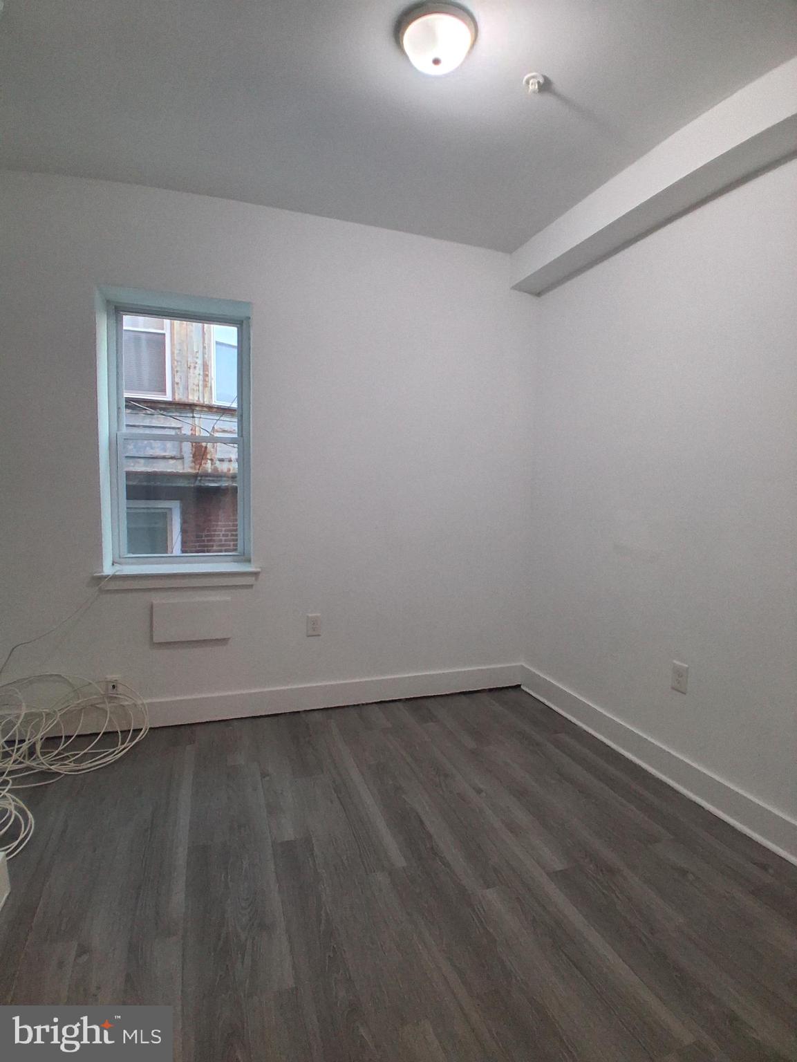 6104 Market Street, Unit 2 Philadelphia, PA 19139 - Photo 8 of 11 wooden floor in an empty room