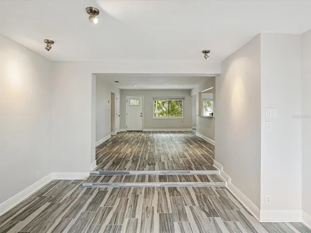 a view of room with window and ceiling fan