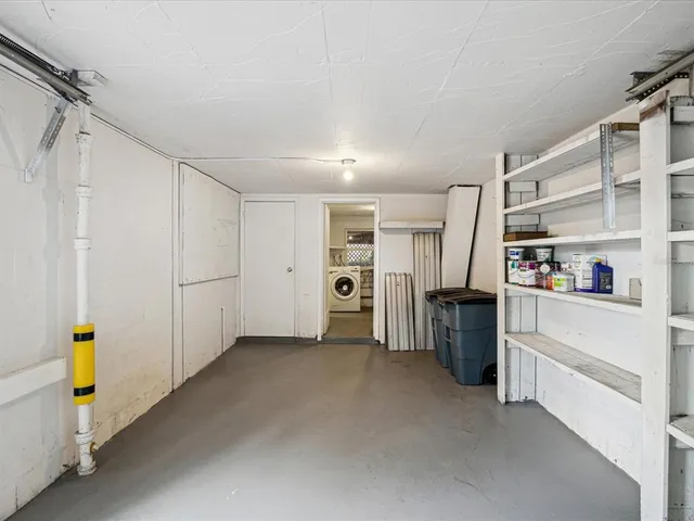 a view of an empty room with shelves
