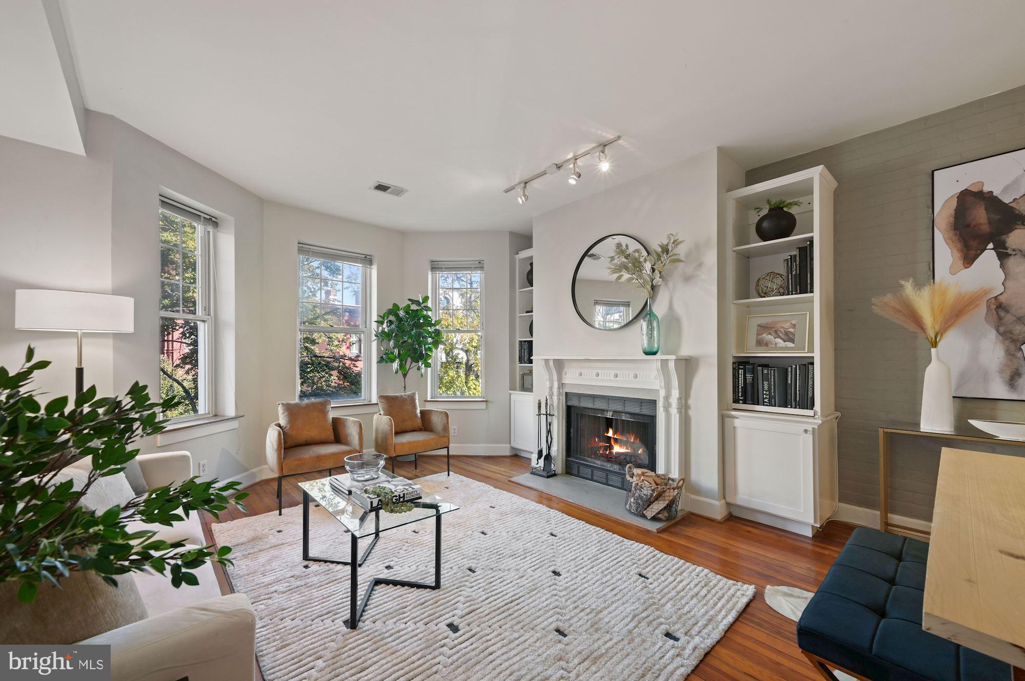1320 R Street Northwest, Unit 5 Washington, DC 20009 - Photo 2 of 17 Lovely living room with bay window & fireplace.