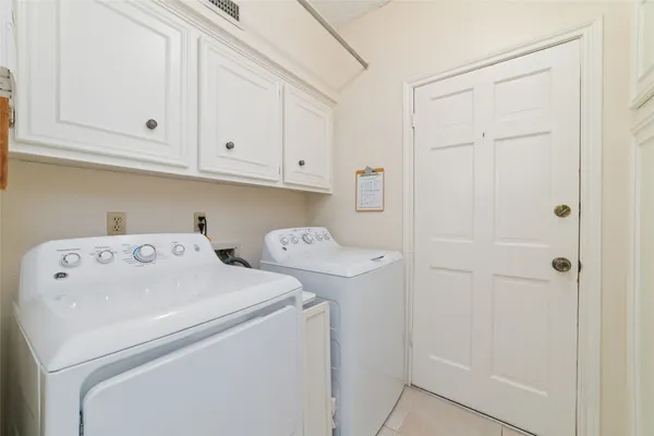 a view of storage and utility room with washer and dryer