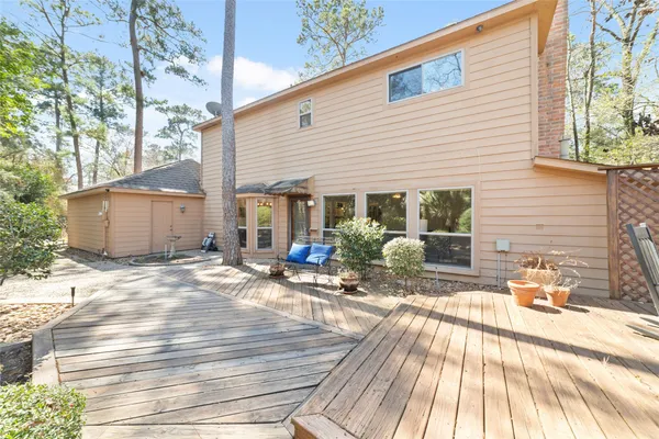 a view of a backyard with sitting area