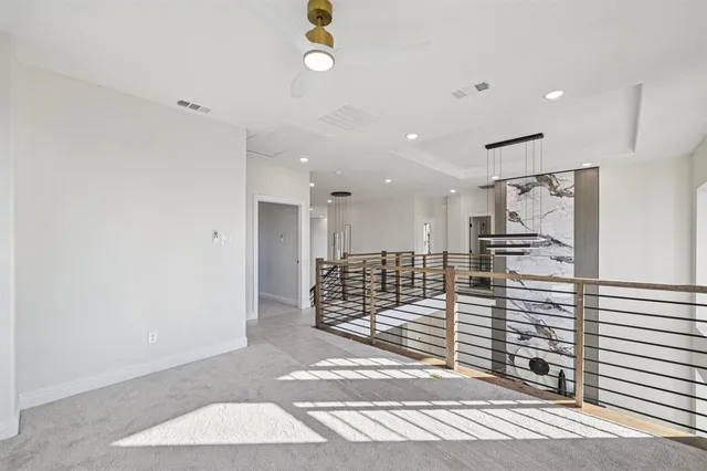 a view of kitchen with stainless steel appliances refrigerator and microwave