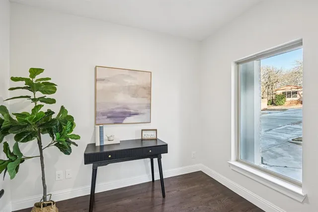 a workspace with furniture and a potted plant