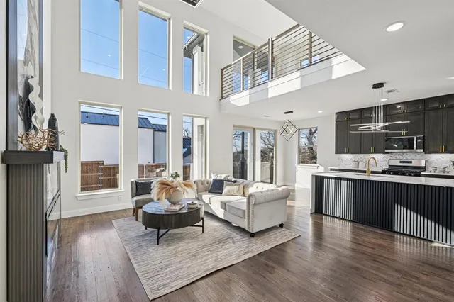 a living room with furniture and kitchen view