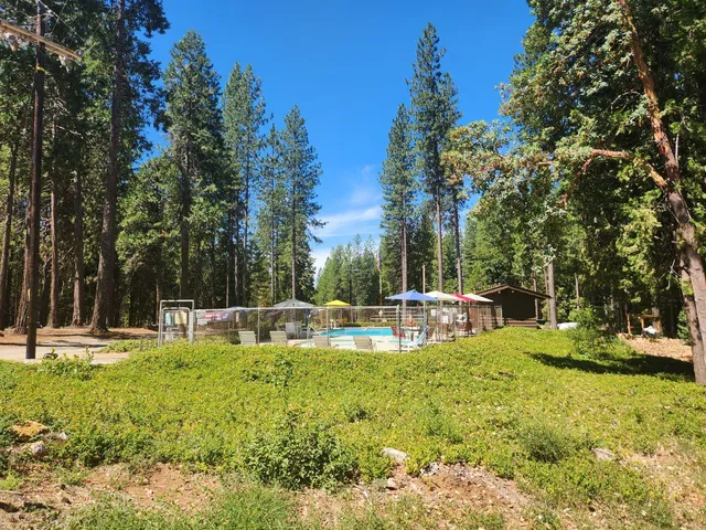 a view of a swimming pool with a sitting area