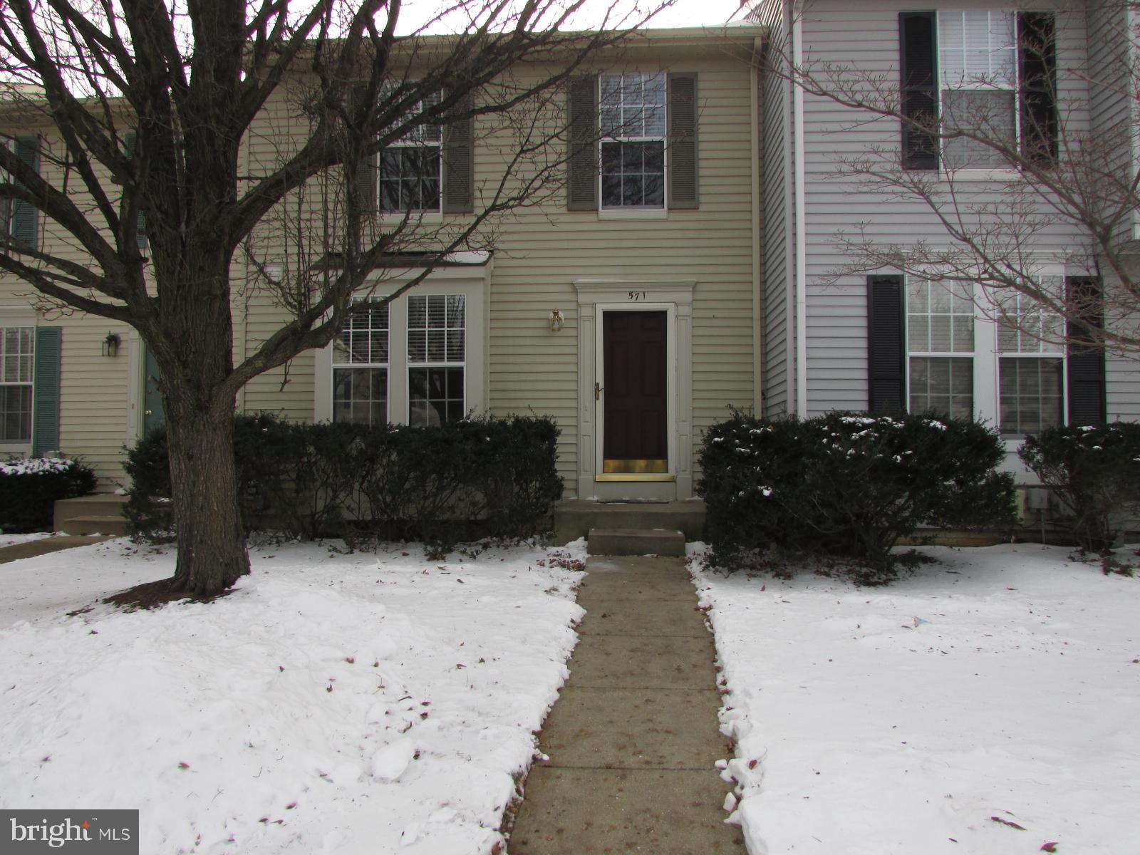 571 Quaker Ridge Court Arnold, MD 21012 - Photo 1 of 17 a view of a house with a yard covered in snow
