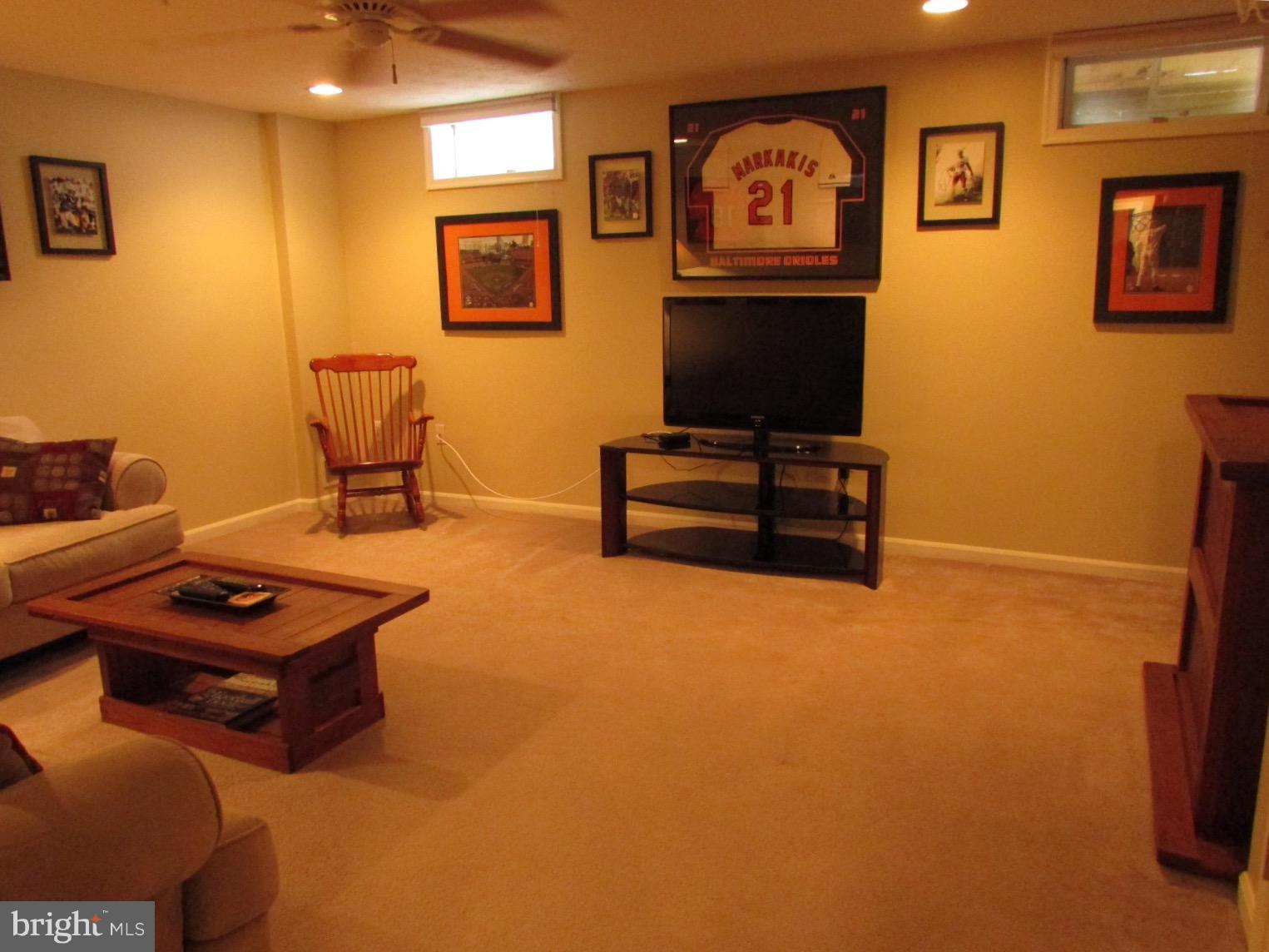 571 Quaker Ridge Court Arnold, MD 21012 - Photo 11 of 17 a living room with furniture and a flat screen tv