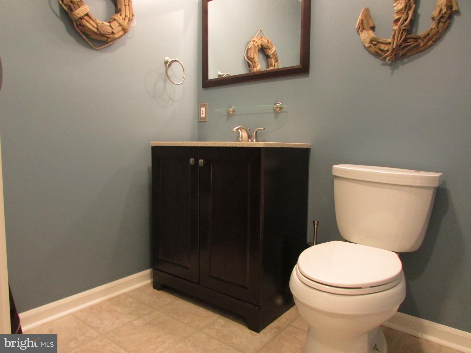 571 Quaker Ridge Court Arnold, MD 21012 - Photo 12 of 17 a bathroom with a toilet and a sink