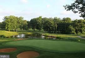 571 Quaker Ridge Court Arnold, MD 21012 - Photo 17 of 17 a view of a golf course with a lake