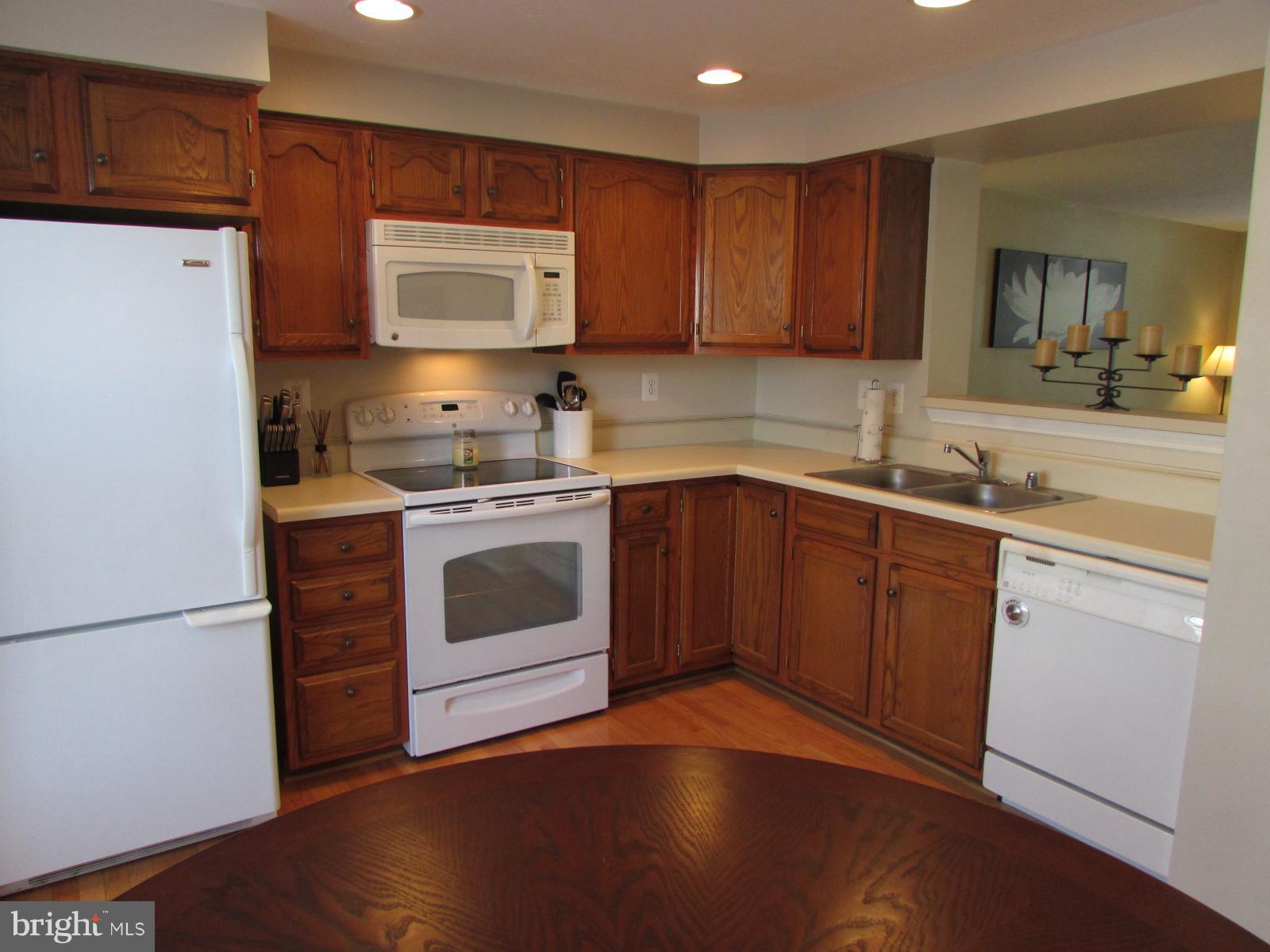571 Quaker Ridge Court Arnold, MD 21012 - Photo 3 of 17 a kitchen with a sink a stove and cabinets