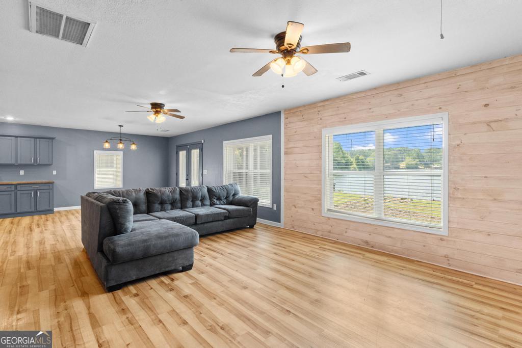 10685 Highway 212 Covington, GA 30014 - Photo 17 of 33 a living room with furniture and a large window