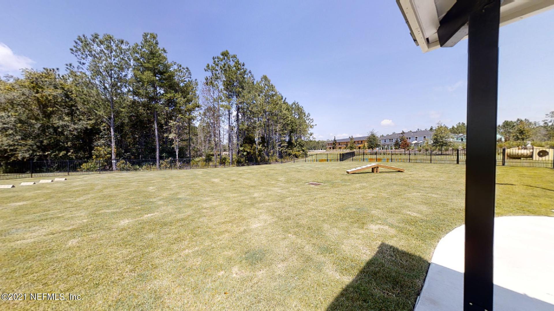 13116 Dunwick Road Jacksonville, FL 32256 - Photo 19 of 26 a swimming pool with outdoor seating and yard