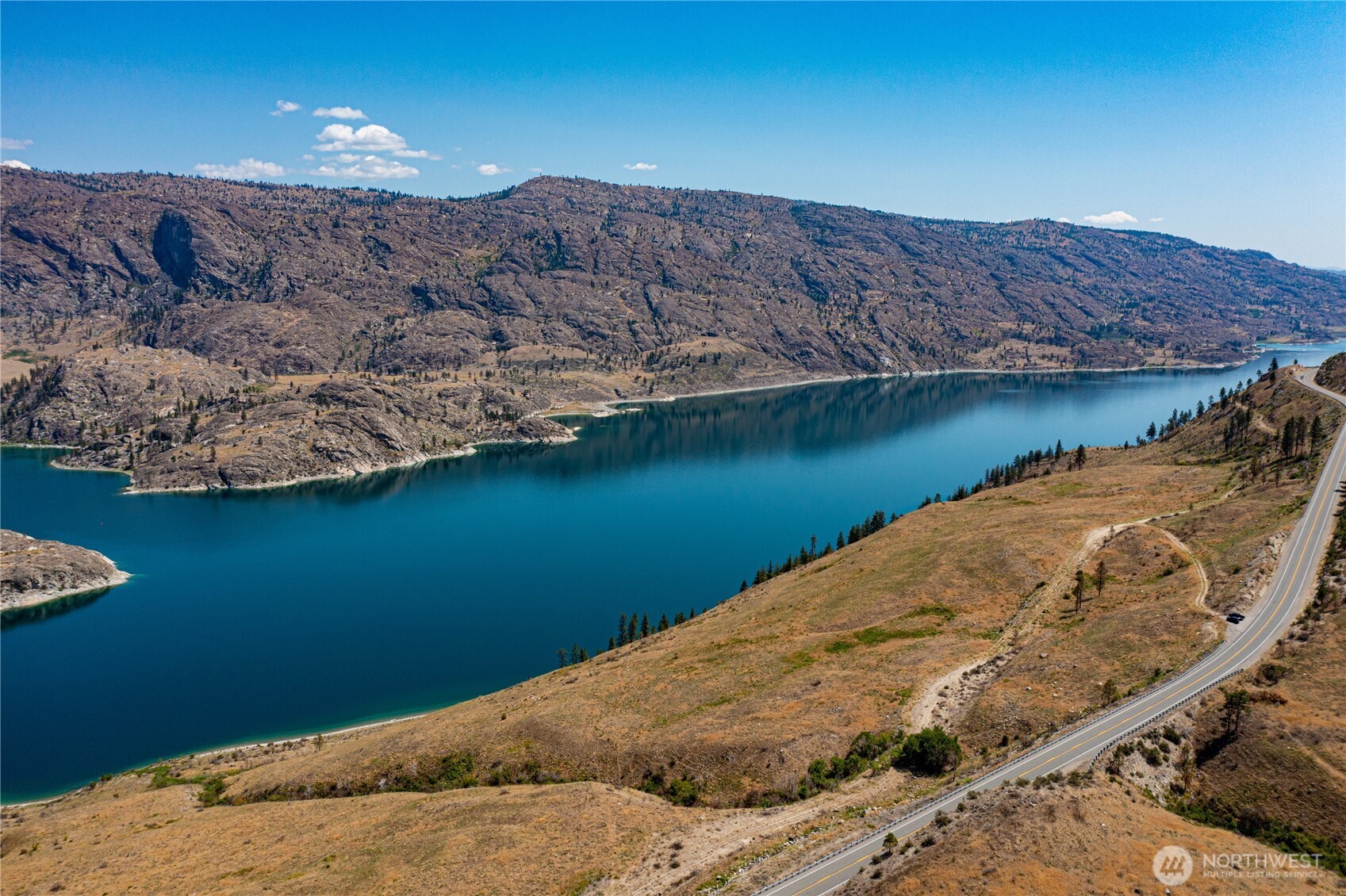 10 Omak Lake Road Okanogan, WA 98840 - Photo 1 of 6 a view of a lake with a mountain