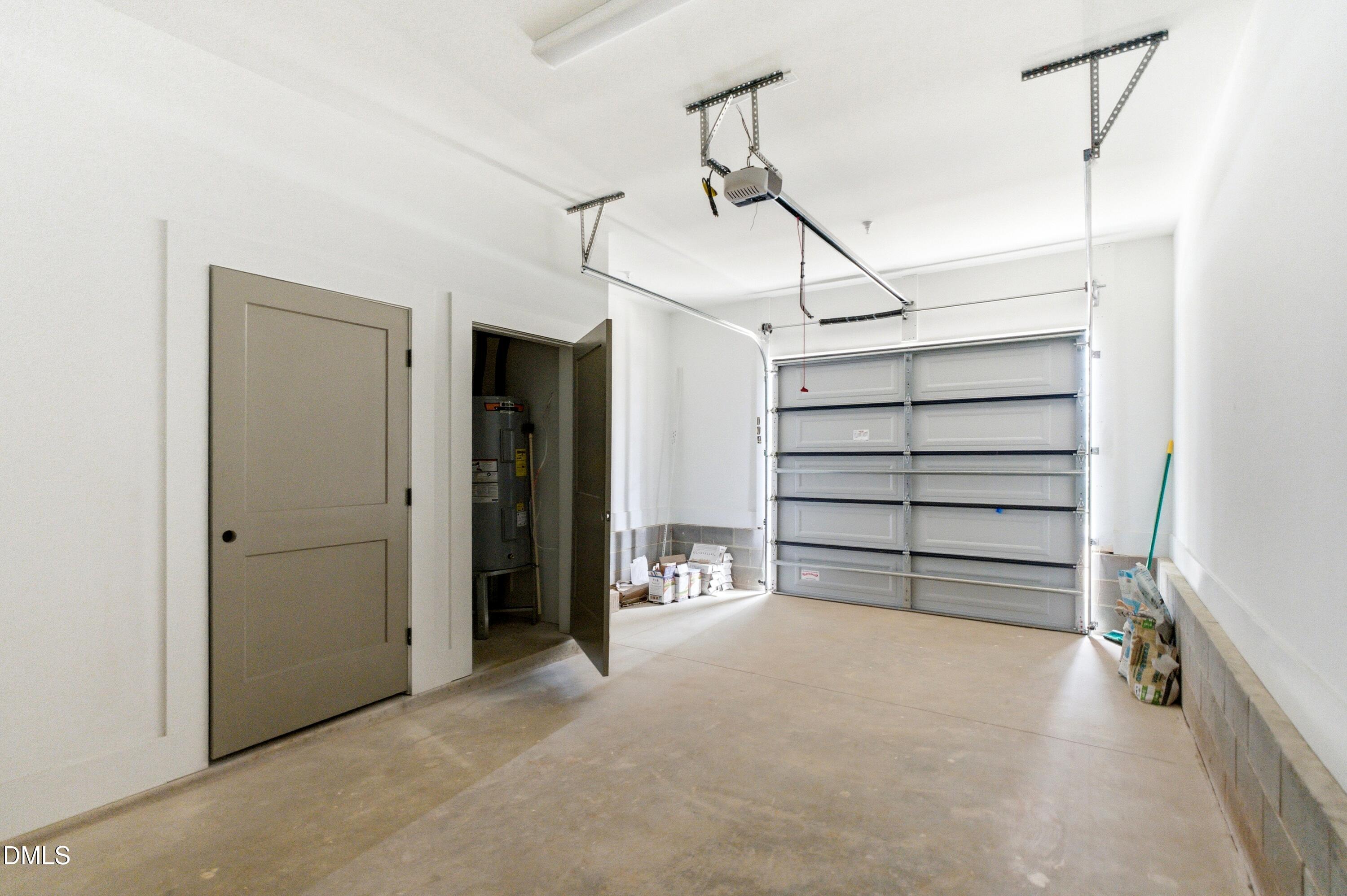 720 Noble Town Way, Unit 104 Raleigh, NC 27603 - Photo 18 of 21 a view of an empty room with a white walls