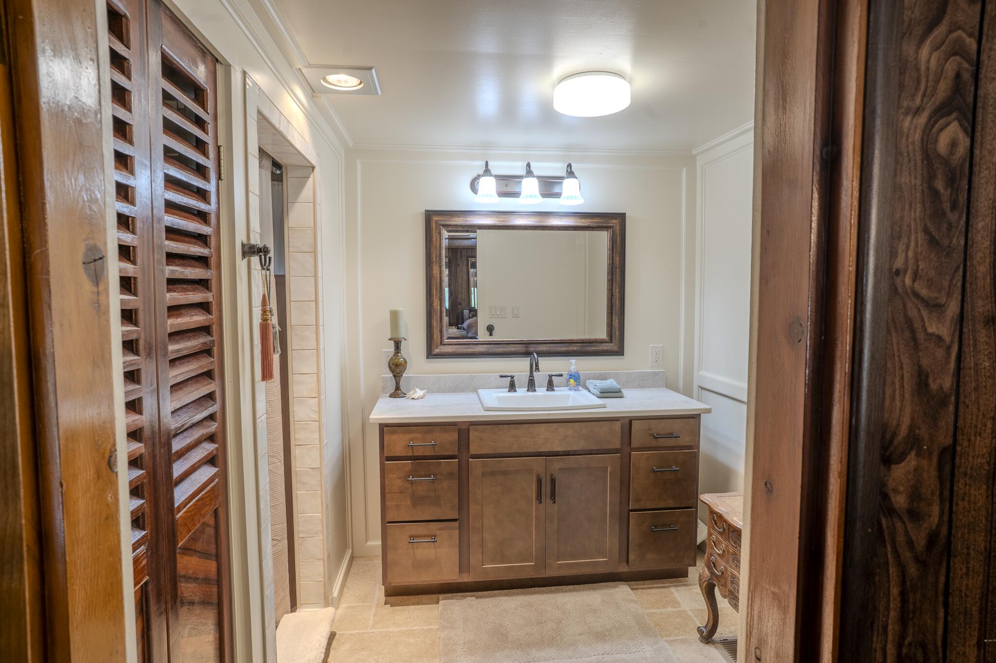 1969 Colestin Road Ashland, OR 97520 - Photo 41 of 72 a bathroom with a double vanity sink and mirror