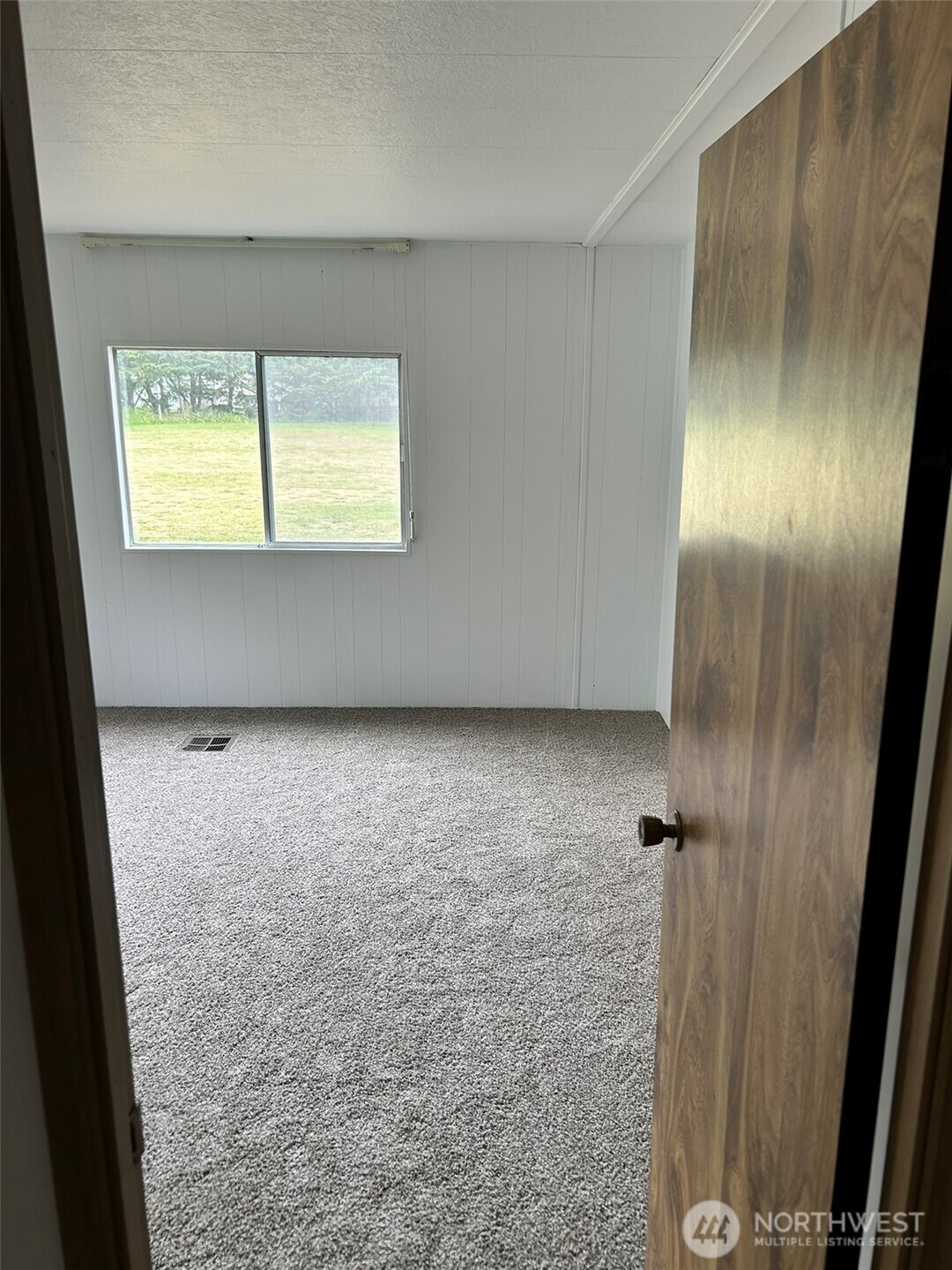 791 Elliot Court Sequim, WA 98382 - Photo 20 of 37 a view of an empty room with a window
