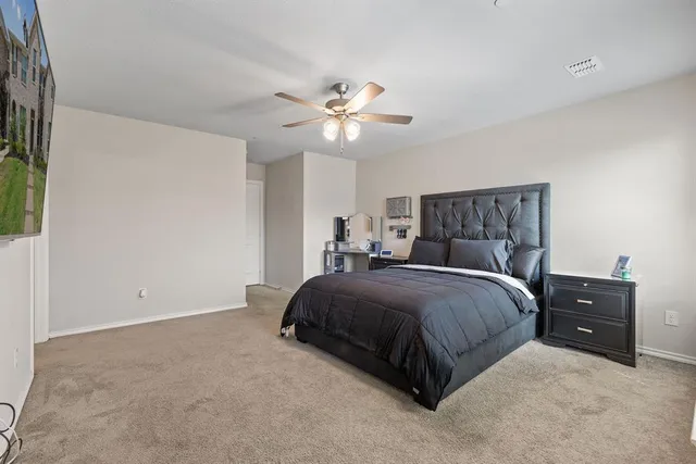 a bedroom with a bed and a window with outer view