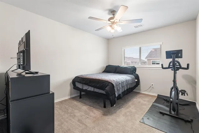 a view of a house with more windows and potted plants
