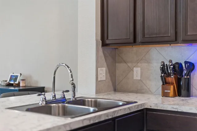 a kitchen with granite countertop a sink and granite counter tops