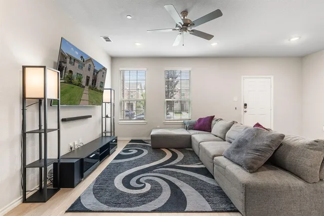 a living room with furniture and a window