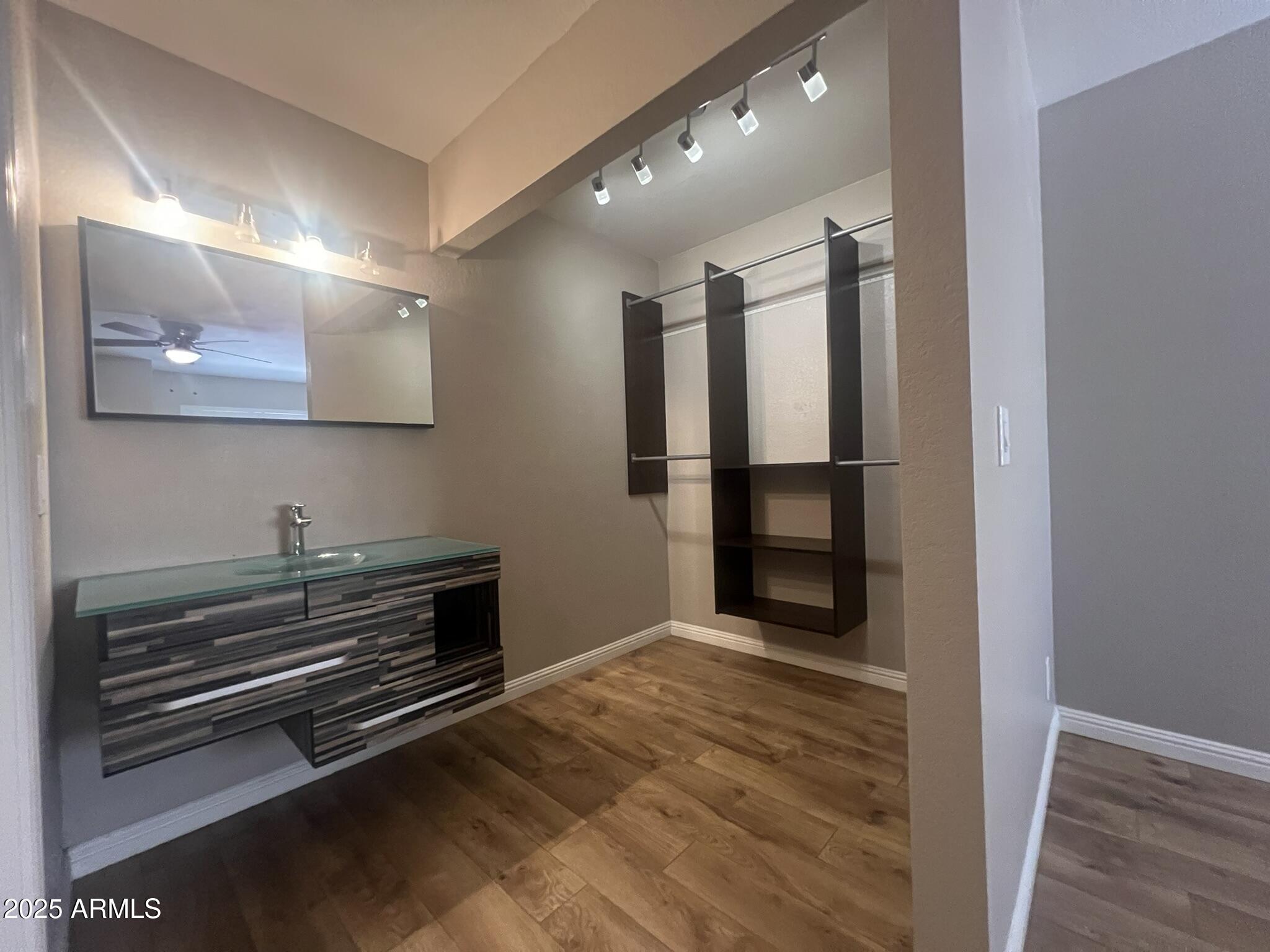 154 West 5th Street, Unit 248 Tempe, AZ 85281 - Photo 14 of 18 a view of a livingroom with wooden floor and kitchen space