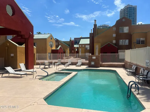 a view of a patio with swimming pool