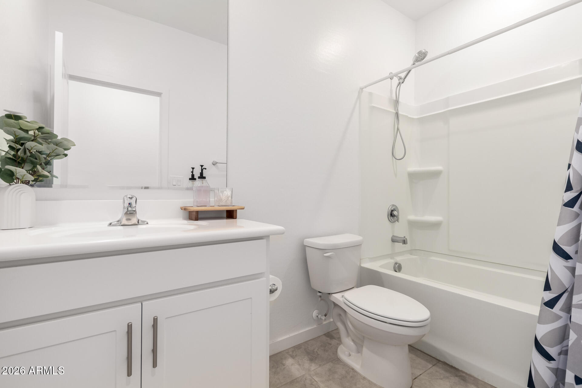 39985 West Rio Lobo Drive Maricopa, AZ 85138 - Photo 21 of 44 a bathroom with a sink toilet vanity and shower