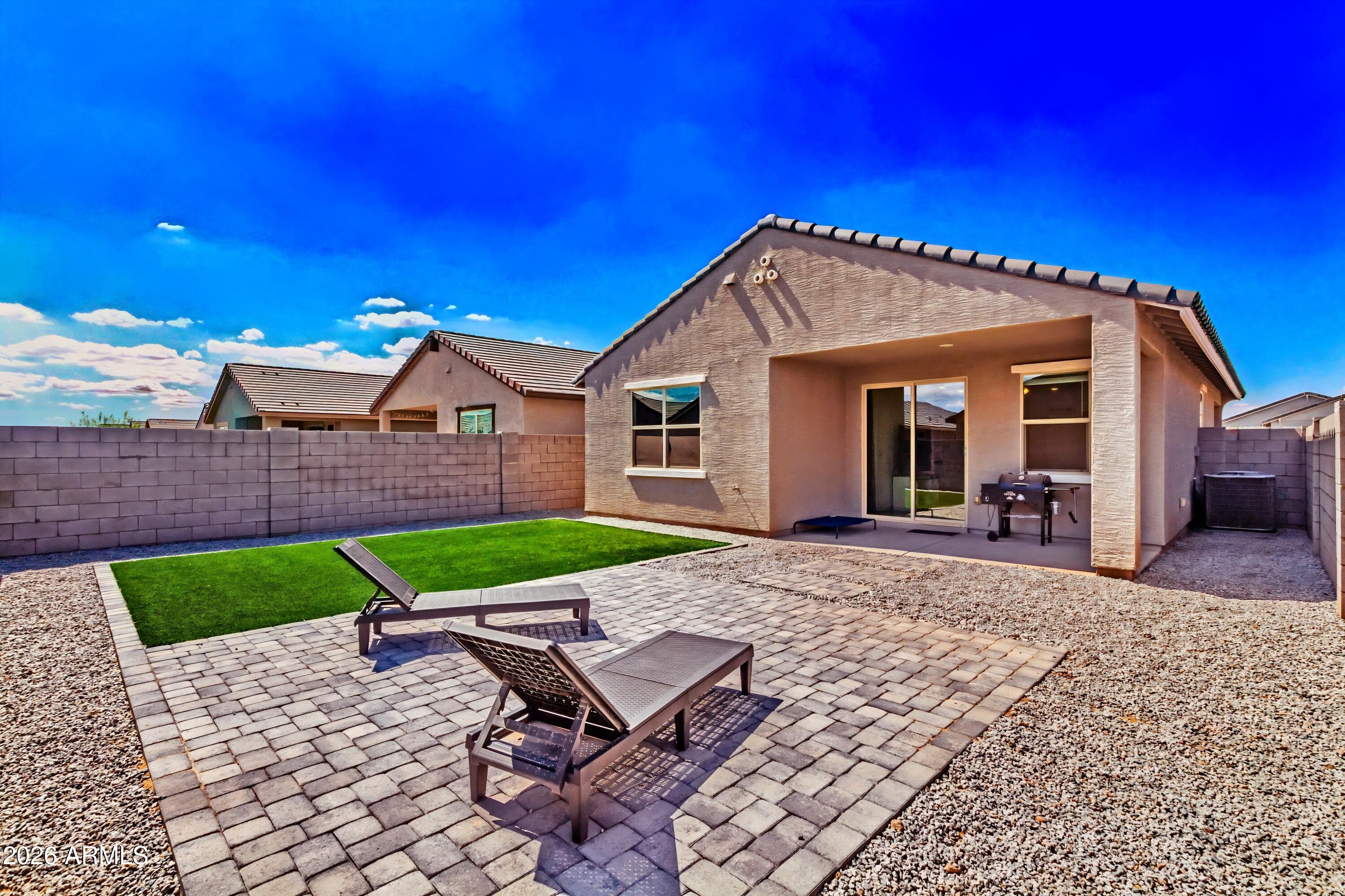 39985 West Rio Lobo Drive Maricopa, AZ 85138 - Photo 26 of 44 a view of a house with backyard and porch