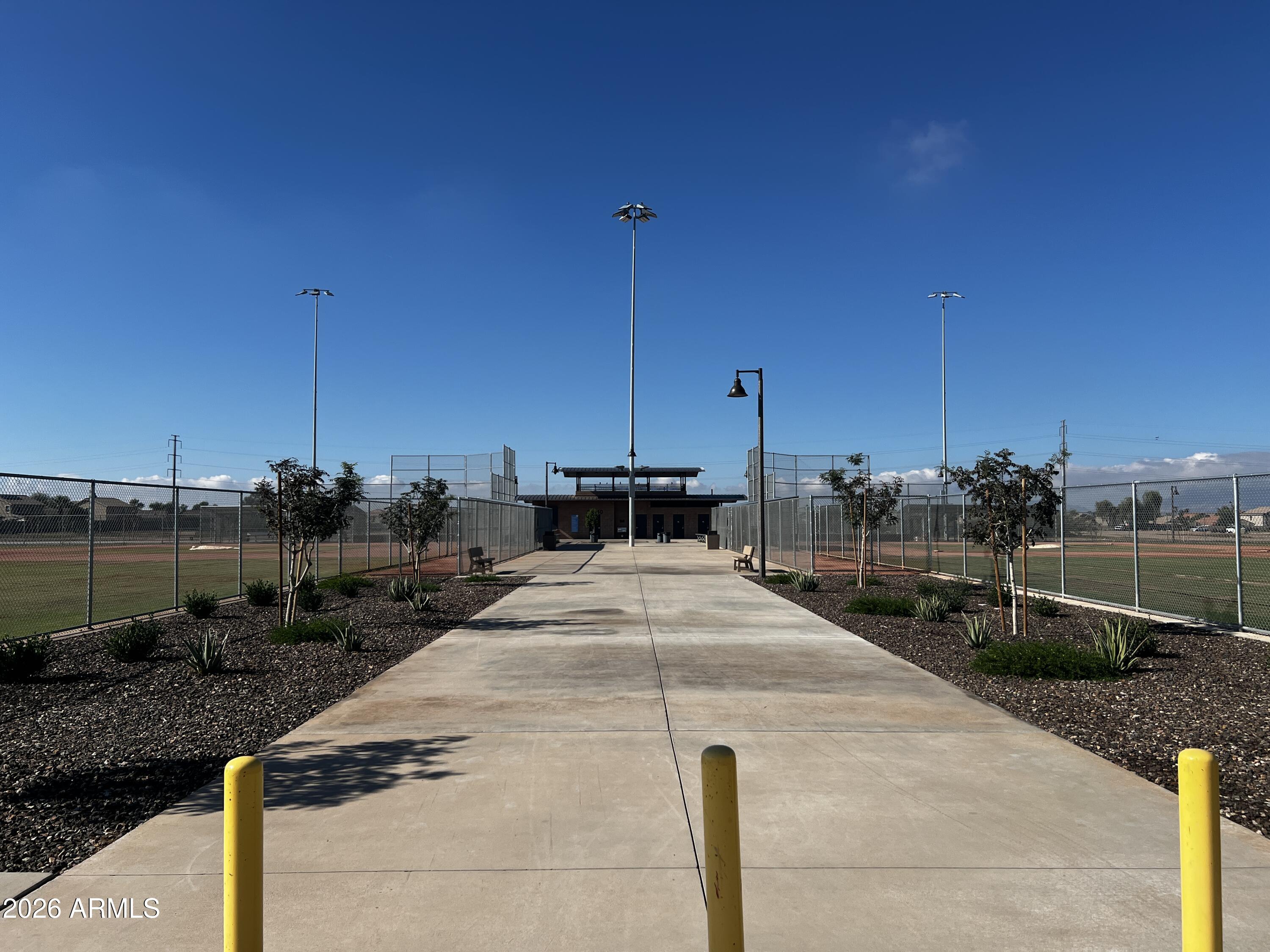 39985 West Rio Lobo Drive Maricopa, AZ 85138 - Photo 33 of 44 a view of a terrace with wooden fence