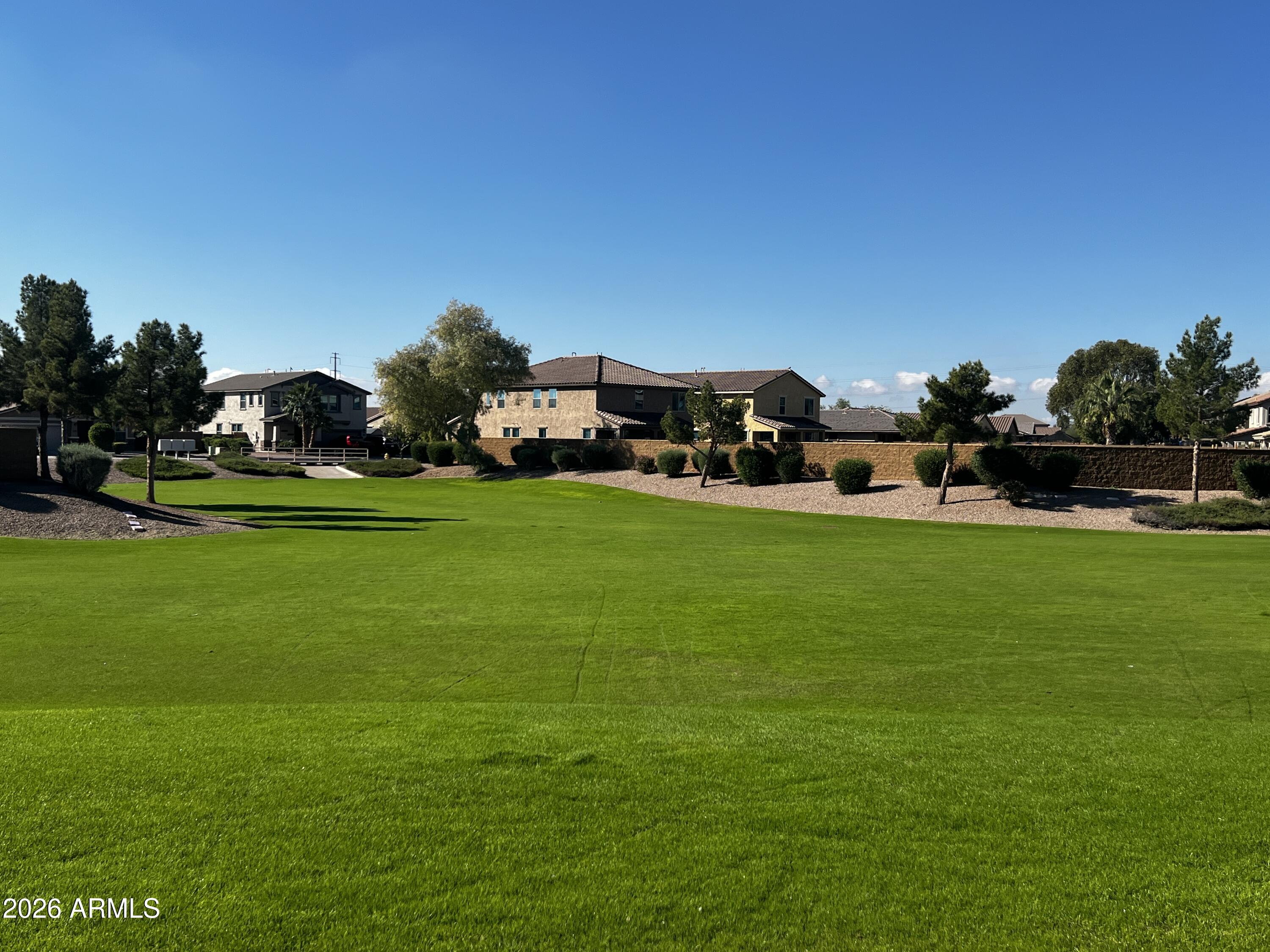 39985 West Rio Lobo Drive Maricopa, AZ 85138 - Photo 42 of 44 a view of a house with a big yard and sitting area