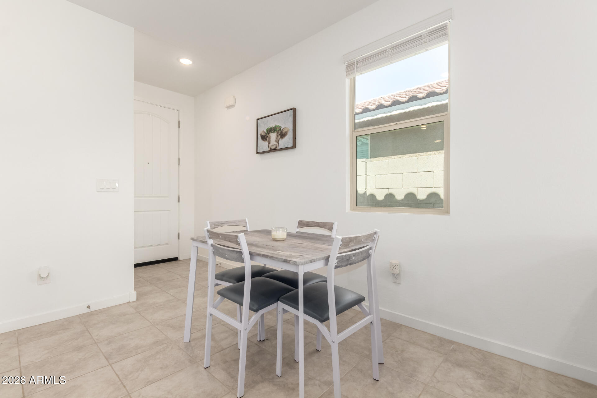 39985 West Rio Lobo Drive Maricopa, AZ 85138 - Photo 6 of 44 a view of a dining room with furniture and a window