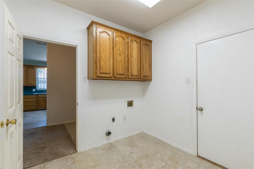 1026 Reeves Street Abilene, TX 79602 - Photo 36 of 38 Laundry room with the 1/2 bath off the garage.