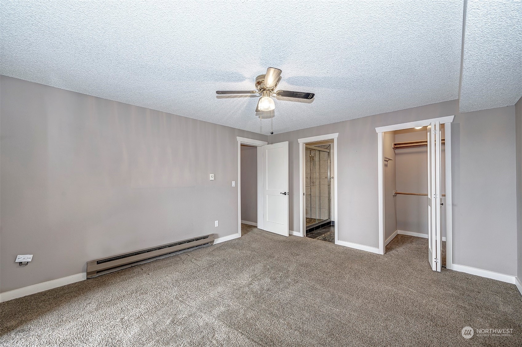 1633 Eagle Ridge Drive South, Unit 6 Renton, WA 98055 - Photo 8 of 17 a view of a room with a ceiling fan and hardwood floor