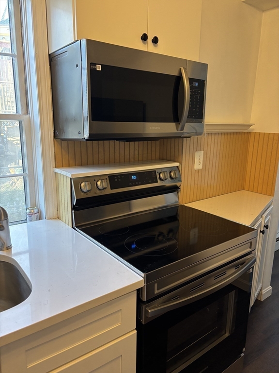 37 Turner Street, Unit 2 Salem, MA 01970 - Photo 3 of 9 a kitchen with stove and microwave
